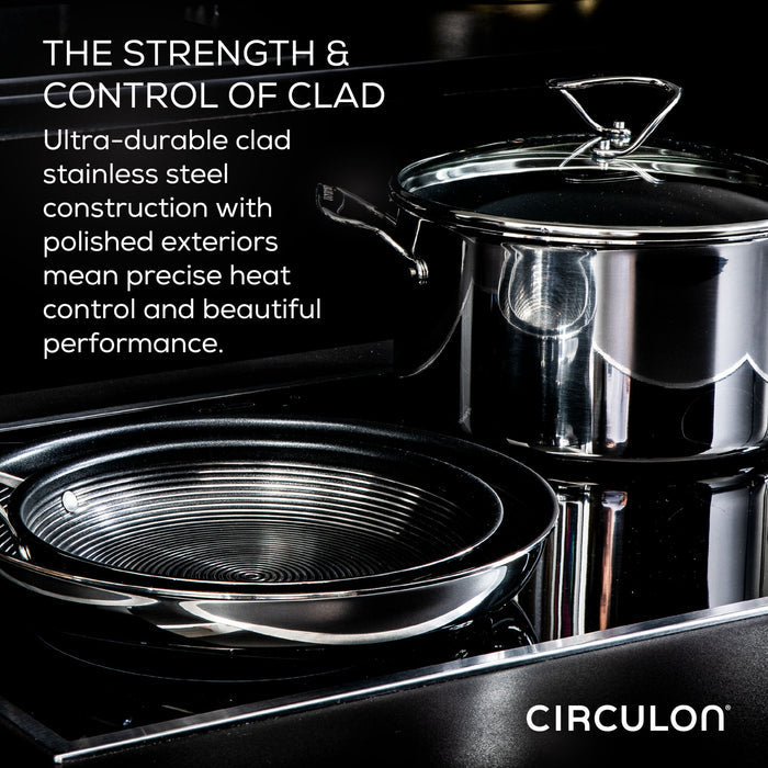 A stunning 12.5" Open Frying Pan, crafted with tri-ply clad stainless steel, is elegantly displayed on a dark kitchen surface, exemplifying the latest in culinary advancements.