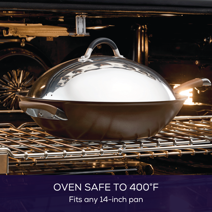 The 14-Inch Stainless Steel Domed Lid, labeled oven safe to 400°F, perfectly fits a covered skillet and includes a silicone grip for safe handling, reflecting the quality synonymous with Circulon products.