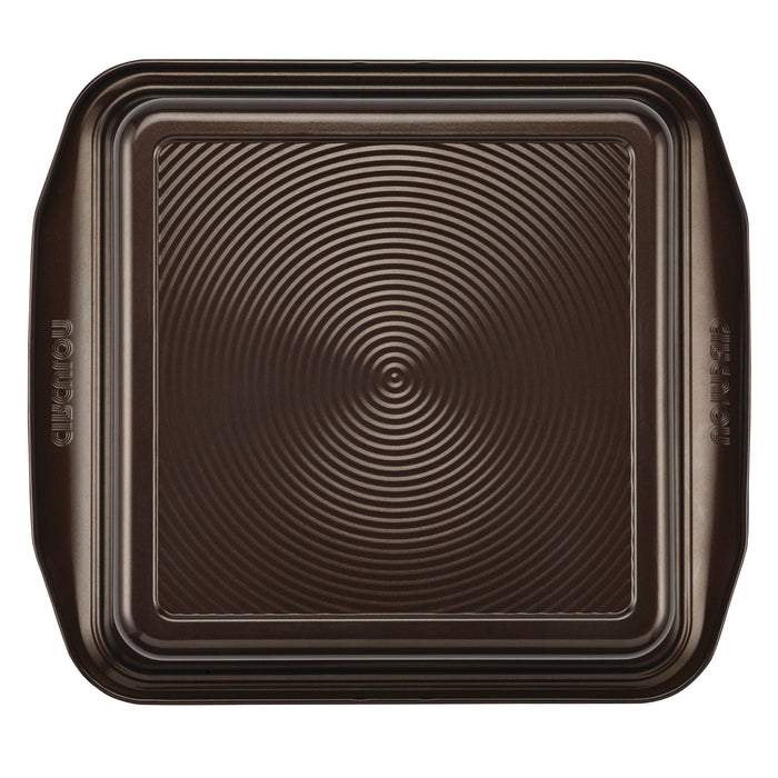 A 9-Inch Nonstick Square Cake Pan, expertly crafted from durable steel construction, features ridged details and a nonstick coating for easy release.