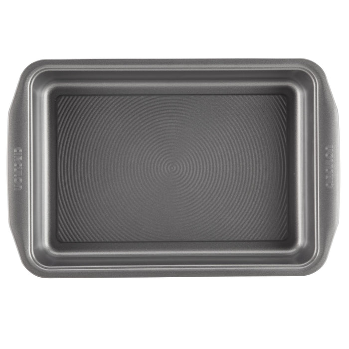 9" x 13" Nonstick Rectangular Cake Pan with a ridged surface, highlighting its sturdy design and nonstick technology, seen from above.