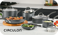 Displayed on the kitchen counter, the cookware set is surrounded by fresh food and vegetables, making it a perfect gift choice for any culinary enthusiast. Consider enhancing your gift with a Circulon.com Gift Card, which can be redeemed at checkout to unlock even more cooking possibilities.