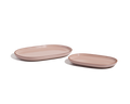 Two oval, light pink Serving Platters of different sizes are arranged side by side on a white background, forming a stylish tableware set.