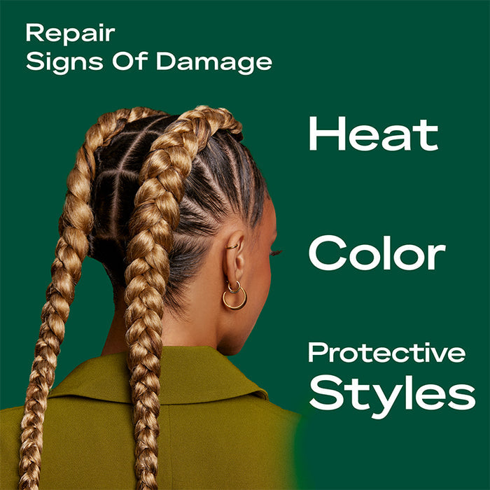 SHEA MOISTURE model with two long braided cornrows showcasing amla oil bond repair conditioner for damaged hair